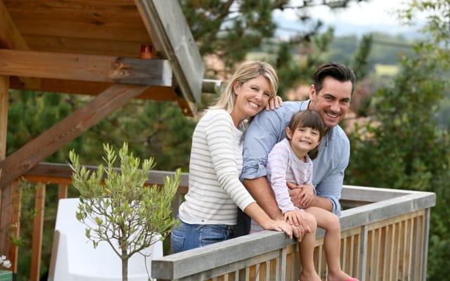 A family enjoying a vacation in a log cabin