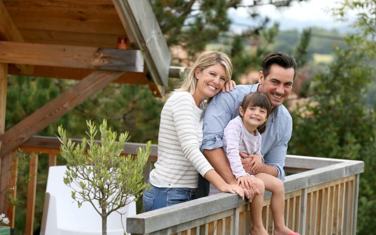 A family enjoying a vacation in a log cabin